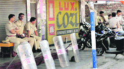 Police personnel on duty during a bandh at Palghar in Mumbai on Wednesday.