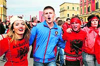 Albanians take part in celebrations in the main street of Tirana, marking the 100th anniversary of independence from the Ottoman Empire on Wednesday