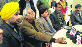 Jasraj Bhatti (in turban) during the launch of a new website of the traffic police in Chandigarh on Thursday. 