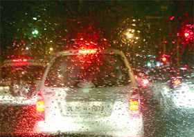 Rain-swept cars in New Delhi on Thursday.