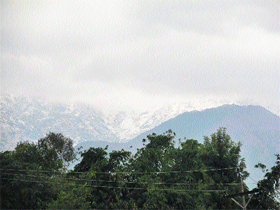 The snow-clad Dhauladhars on Thursday.