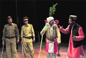 Artistes perform a scene from the play Gaanv ka Lambardar, organised by the Brijeshwar Kala Manch, at Gaiety Theatre in Shimla.