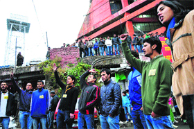 Akhil Bharatiya Vidyarthi Parishad activists protest against the fee hike at Himachal Pradesh University in Shimla on Thursday.
