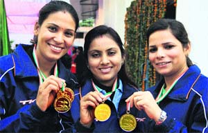CRPF shooters Rachna Devi, Pushpanjali and SarveshTomar with their medals in Jalandhar on Thursday. 
