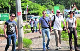 Italian marines Massimiliano Latorre (second from left) and Salvatore Girone (left) with country officials after appearing at the office of the Commissioner of Police in Kochi on Thursday