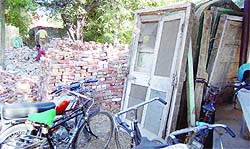Doors, bricks and other materials at the demolition site at District Court Complex in Amritsar.