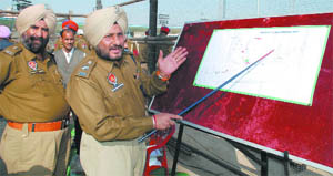 SSP Ravcharan Singh Brar explains the traffic diversion on Friday. 