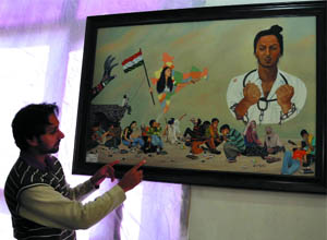 An artist explains his work at the art festival organised by the Sobha Singh Memorial Chittarkar Society that began at Teachers' Home in the city on Thursday. 