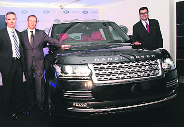 Land Rover studio design director Phil Simmonds South (L), global Range Rover brand manager Scot Dicken and JLR India VP Rohit Suri (R) at Tata Motors-owned Jaguar Land Rovers India launch of the all new version of the Range Rover SUV in Gurgaon on Thursday.