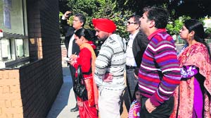 Parents read the admission notice at Bhavan Vidyalaya Junior School in Sector 33 on Friday
