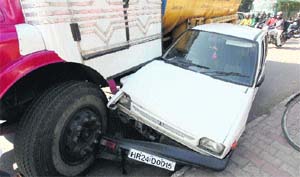 The damaged car that met with an accident near the traffic light point in Sector 26, Chandigarh.