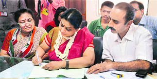 Shweta Bhatt, wife of Sanjeev Bhatt (R), files her papers as the Congress candidate from the Maninagar seat on Friday. 