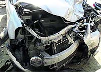 The mangled remains of the car that collided with a scooter on the Ludhiana-Ferozepur highway