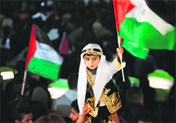 Palestinians celebrate in the West Bank city of Ramallah on Friday.  AFP