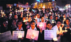 Nursing college students and Chief Parliamentary Secretary Navjot Kaur Sidhu take out a candlelight march to mark World AIDS Day in Amritsar on Saturday