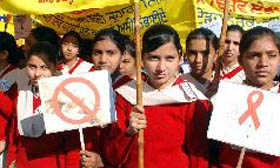 Students hold posters and placards during the rally.