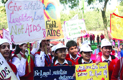 Schoolchildren take out an awareness rally on the occasion of the World AIDS Day in New Delhi on Saturday. 
