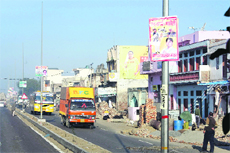 Posters along the National Highway passing through Rohtak.