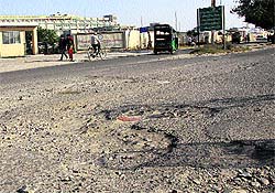 The lane of Garha Road, which has been relaid, has huge potholes in front of PIMS in Jalandhar