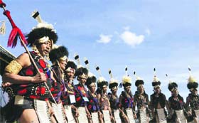 Promoting tourism: Naga tribesmen dance on the first day of the Hornbill Festival at Kisama near Kohima on Saturday