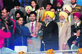 Deputy Chief Minister Sukhbir Badal holds the baton during the inaugural function of the World Kabaddi Cup in Bathinda on Saturday