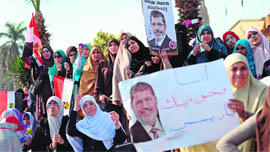 Women take part in a rally of Islamists outside Cairo University in support of President Mohamed Mursi on Saturday.