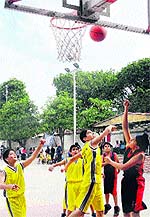 Players in action during the Lt Col Balraj Singh Sub-Junior State Basketball Championship for Boys at Sector 18 in Chandigarh on Sunday