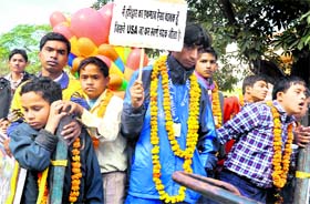 Differently abled children participate in an awareness rally on the occasion of World Disability Day.