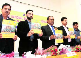 Office-bearers of the All-India Punjab National Bank Employees Association release a magazine at their triennial convention in Dehradun on Sunday.