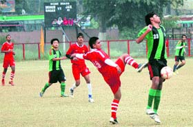 Players in action during a match of the Christmas Soccer Championship at the GGM Science College ground in Jammu on Sunday.