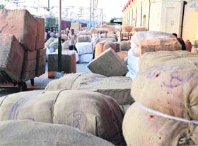 Hosiery goods parcels, booked for various destinations in the country, lie scattered at the Ludhiana railway station.
