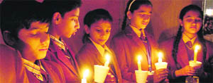 Students of DAV Public School pay tributes to hockey legend Dhyan Chand on his death anniversary in Amritsar on Monday.