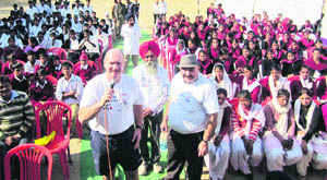 Canadian province British Columbias Finance Minister Michael de Jong interacts with students at Mannawala on Monday.