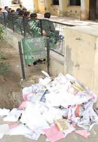 The trash can near the principals office in Government Rajindra College, Bathinda, is damaged and all the waste is dumped outside giving the place a cluttered look. 