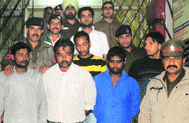 The six accused in police custody at the Sector 31 police station in Chandigarh.