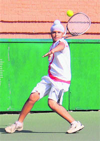 Yuvraj Singh in action during a tennis match at the CLTA,  Sector 10, Chandigarh, on Monday.