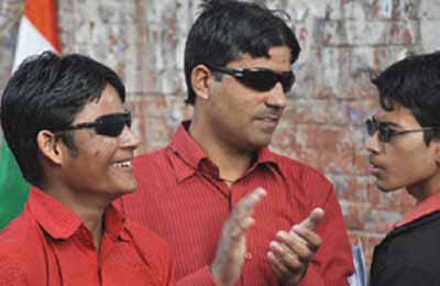 Visually impaired participants in a rally for their rights on International Day of People with Disability in New Delhi on Monday.