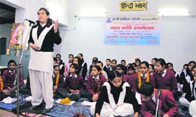 A girl recites a poem at bal kavi sammelan held at Hindi Bhawan in Dehradun.