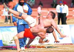 Argentinian and Iranian players in action during the third World Cup Kabaddi match in Hoshiarpur on Monday. Tribune photo: Malkiat Singh