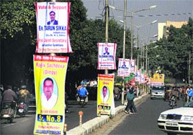 Illegal hoardings of candidates for the Gymkhana Club election dot the divider leading to the club premises in Jalandhar on Monday