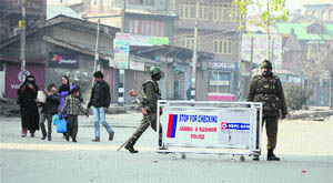 CRPF personnel at a security barricade in the old city area of Srinagar on Monday