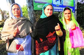 Woman voters after casting their vote for the Member of Legislative Council (MLC) elections at Pouni in Reasi on Monday.