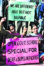A speech impaired person communicates his demands in Jammu on Monday.