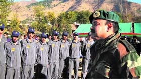 Commander Sector 6 RR Brigadier HS Shanbag interacts with students before flagging off a tour at Kalai in Poonch on Monday.