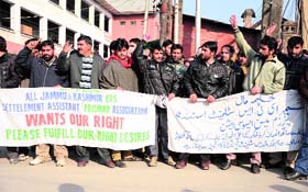 Employees of the Revenue Department raise slogans against the government in Srinagar on Monday.