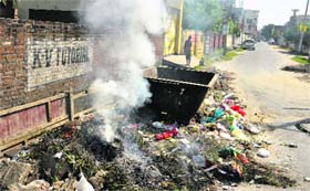 Garbage burnt near the bus stand instead of disposing at a proper place.