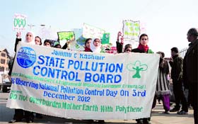 Students of various schools hold banners and placards during an awareness rally at MA Road in Srinagar against the use of polythene in Kashmir.