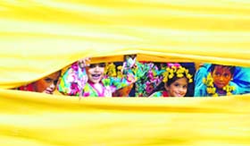 Children try to see the performance of their schoolmates from the backstage during the annual function at Sacred Heart Convent School, Sarabha Nagar, in Ludhiana
