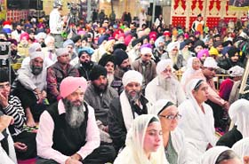 Devotees attend a kirtan samagam at Gurdwara Nanaksar in Samrala Chowk on Monday