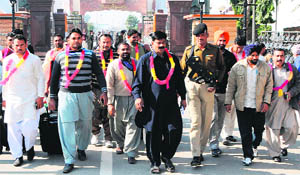 Headed by coach Tahir Muhid, a 16-member Pakistani kabaddi team arrives at the Attari-Wagah border on Monday.